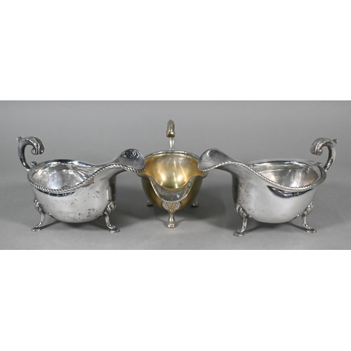 17 - A pair of cut glass vases with silver collars, a silver-backed hairbrush and a silver-topped hatpin/... 