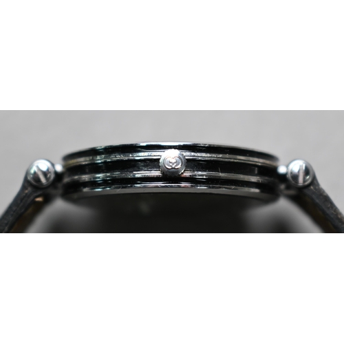 192 - A Gucci GQ2040M stainless steel gents wrist watch, black dial, on Gucci branded black textured leath... 
