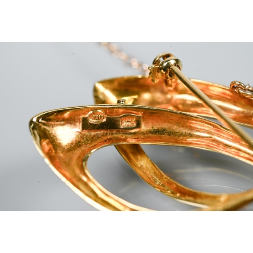 208 - An 18ct yellow gold brooch in the form of a double stylised scroll, set with ten small round rubies ... 