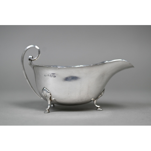 21 - A silver sauce boat on three hoof feet, Birmingham 1924, to/w an egg cup, Birmingham 1959 (2), 3.4oz