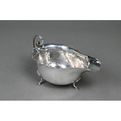 21 - A silver sauce boat on three hoof feet, Birmingham 1924, to/w an egg cup, Birmingham 1959 (2), 3.4oz