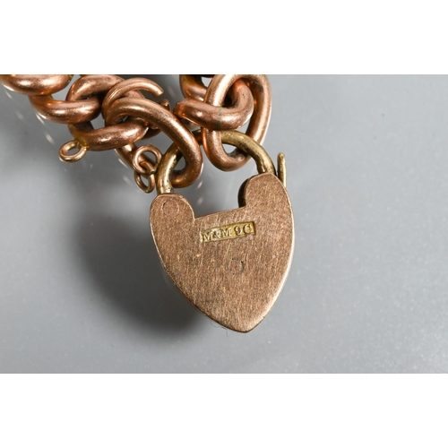 210 - A 9ct rose gold double Albert with two swivels and badge attached, to/w a 9ct curb bracelet with pad... 