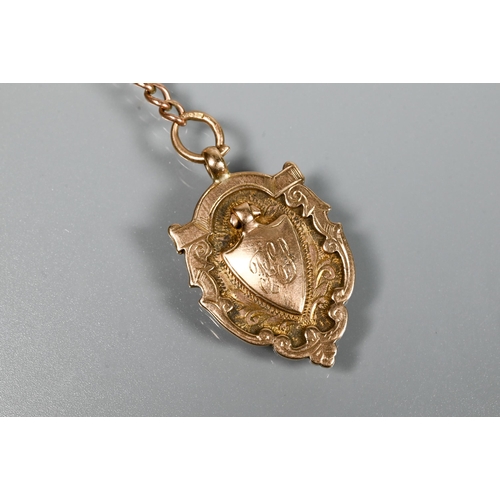 210 - A 9ct rose gold double Albert with two swivels and badge attached, to/w a 9ct curb bracelet with pad... 