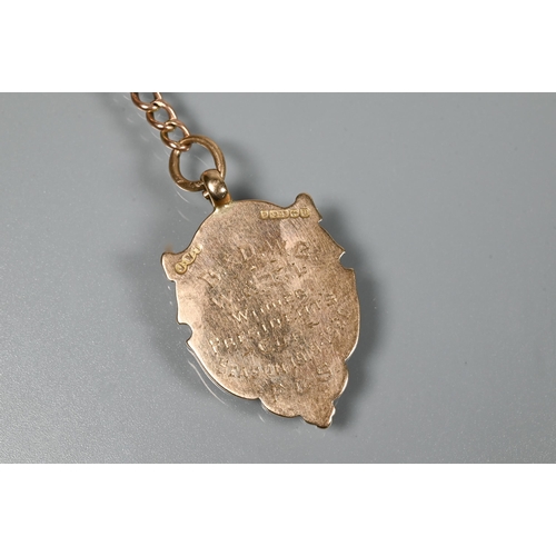 210 - A 9ct rose gold double Albert with two swivels and badge attached, to/w a 9ct curb bracelet with pad... 