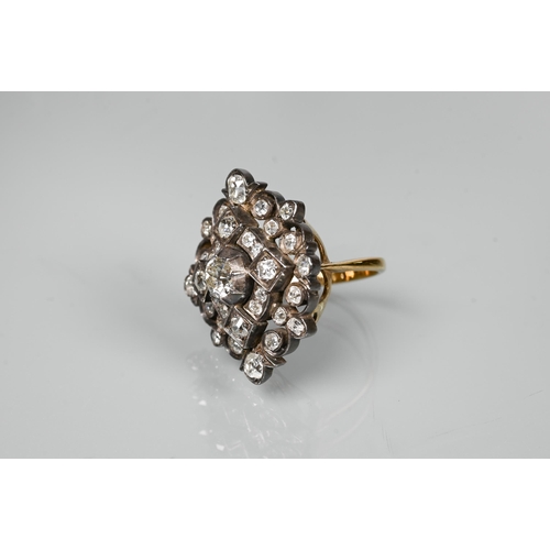 217 - An antique diamond cluster ring, the central old cut diamond sourrounded by a cluster of thirty-two ... 