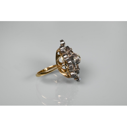 217 - An antique diamond cluster ring, the central old cut diamond sourrounded by a cluster of thirty-two ... 