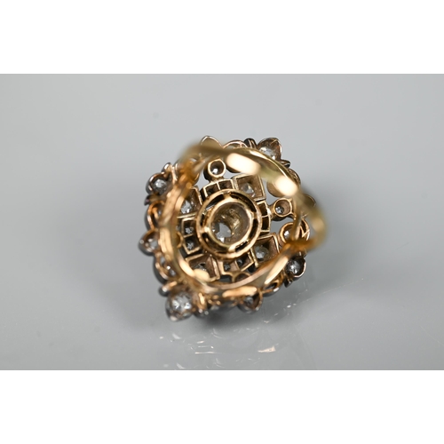 217 - An antique diamond cluster ring, the central old cut diamond sourrounded by a cluster of thirty-two ... 
