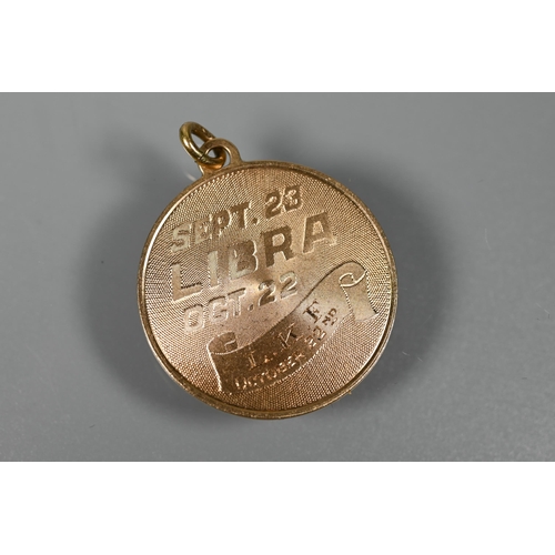 231 - Four various 9ct yellow metal pendants - two for Libra, one for Aquarius and one archery, approx 16.... 