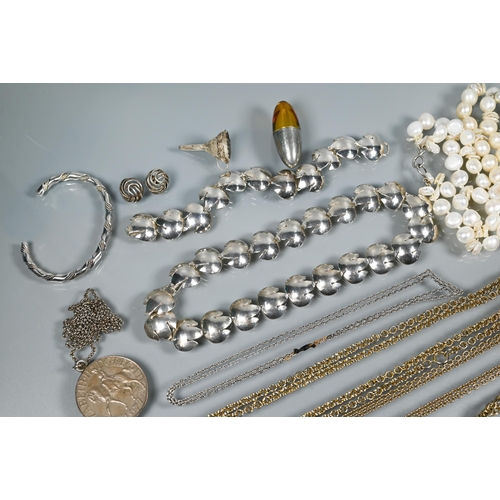 235 - A silver necklace and bracelet set formed of stylised tulip head links, maker Esther Eyre, to/w perf... 