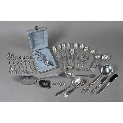 29 - A set of thirteen Norwegian .830 grade teaspoons, seven matching petit fours forks, a sugar spoon an... 