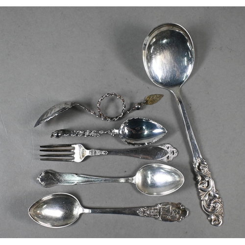 29 - A set of thirteen Norwegian .830 grade teaspoons, seven matching petit fours forks, a sugar spoon an... 