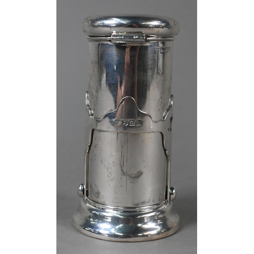 32 - A WW1 silver campaign shaving water-heater with hinged bun cover, rising on brackets to expose spiri... 