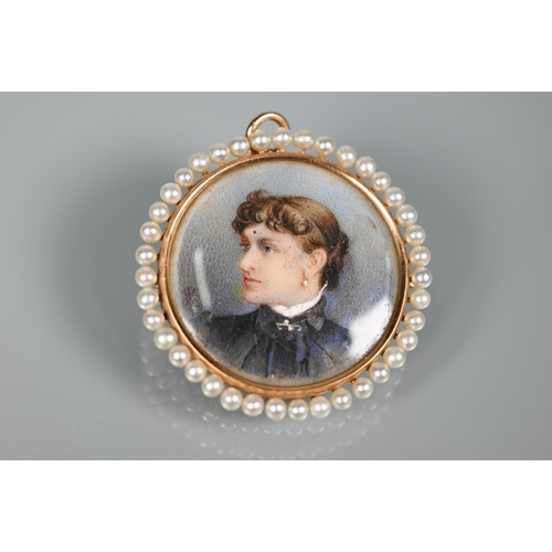 336 - A Victorian portrait miniature on ivory as a pendant, featuring young lady, yellow gold set with bro... 