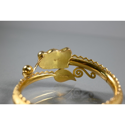 337 - A Chinese yellow gold half-hinged bangle in the form of a coiled dragon chasing the flaming pearl, t... 