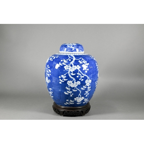 352 - A large 19th century Chinese blue and white ginger jar wand domed cover decorated with prunus on cra... 