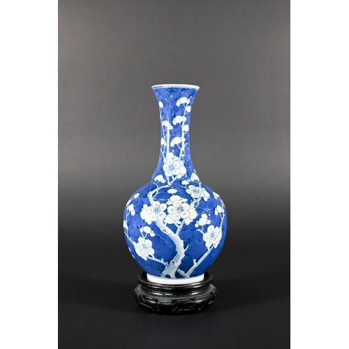 354 - A late 19th century Chinese blue and white globular vase, tianqiu ping, decorated with prunus on cra... 