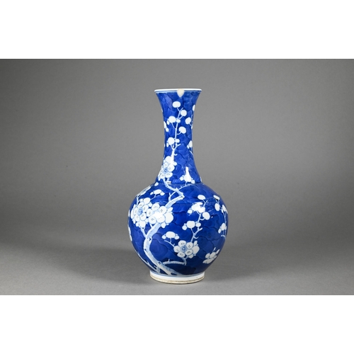 354 - A late 19th century Chinese blue and white globular vase, tianqiu ping, decorated with prunus on cra... 