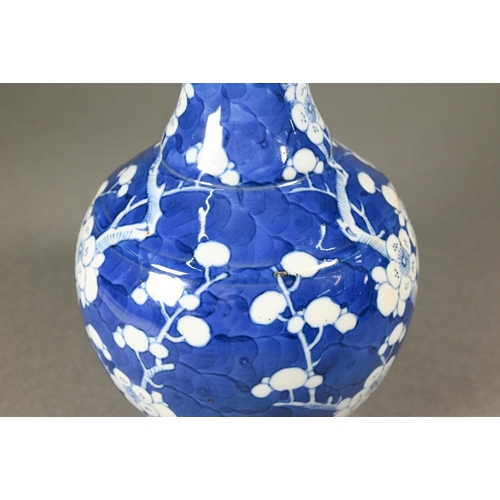 354 - A late 19th century Chinese blue and white globular vase, tianqiu ping, decorated with prunus on cra... 