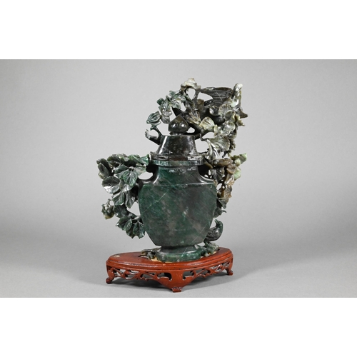 356 - A 20th century Chinese green hardstone vase and cover decoratively worked with various birds and flo... 