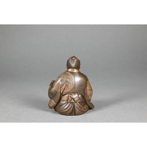 362 - A 19th century Japanese bronze okimono of a seated artisan, Meiji period (1868-1912) signed 火 用 (Bew... 