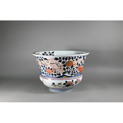 A large 18th century Japanese Arita flared bowl, painted with a continuous design of peonies and prunus in the Imari pallette with underglaze blue and gilt highlighted polychrome enamels, Edo period, 37 cm dia. x 25 cm high 