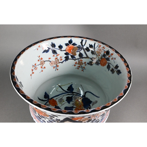 363 - A large 18th century Japanese Arita flared bowl, painted with a continuous design of peonies and pru... 