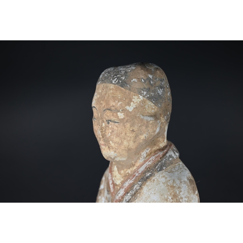 367 - A Chinese pottery funerary figure in the Han dynasty style, 32 cm high to/w to/w a Ming style green ... 