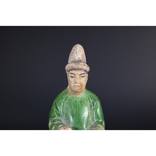 367 - A Chinese pottery funerary figure in the Han dynasty style, 32 cm high to/w to/w a Ming style green ... 