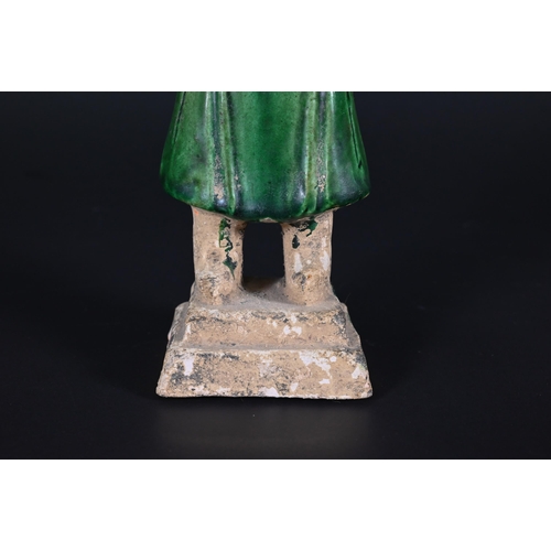 367 - A Chinese pottery funerary figure in the Han dynasty style, 32 cm high to/w to/w a Ming style green ... 