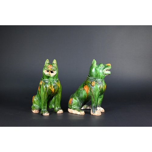 369 - A pair of Chinese Tang style sancai glazed earthenware seated dogs, 19 cm high to/w a pair of Buddhi... 