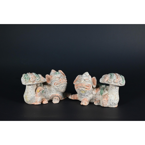 369 - A pair of Chinese Tang style sancai glazed earthenware seated dogs, 19 cm high to/w a pair of Buddhi... 