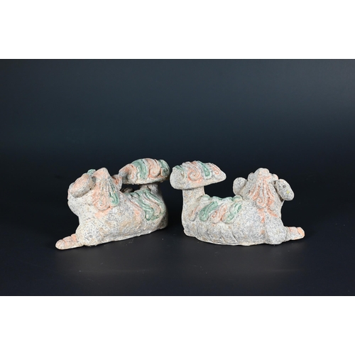 369 - A pair of Chinese Tang style sancai glazed earthenware seated dogs, 19 cm high to/w a pair of Buddhi... 