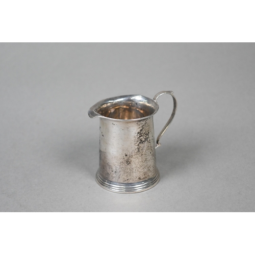 37 - A Victorian silver bowl of compressed form, London 1890, to/w a small cream jug, a George II punch l... 