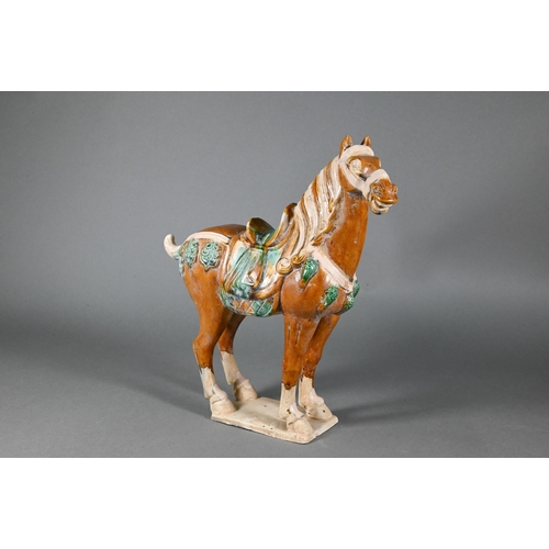 374 - A Chinese Tang style funerary/tomb figure of a horse with sancai glaze, 30 cm high to/w two smaller ... 