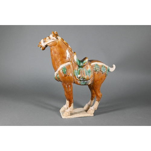 374 - A Chinese Tang style funerary/tomb figure of a horse with sancai glaze, 30 cm high to/w two smaller ... 