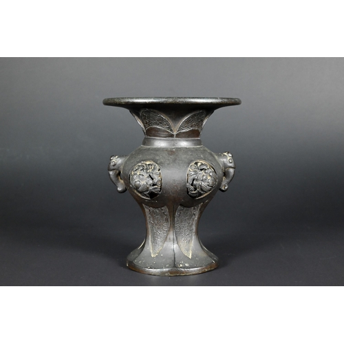 379 - A 19th century Chinese bronze archaistic vase with elephant mask handles and high relief floral roun... 