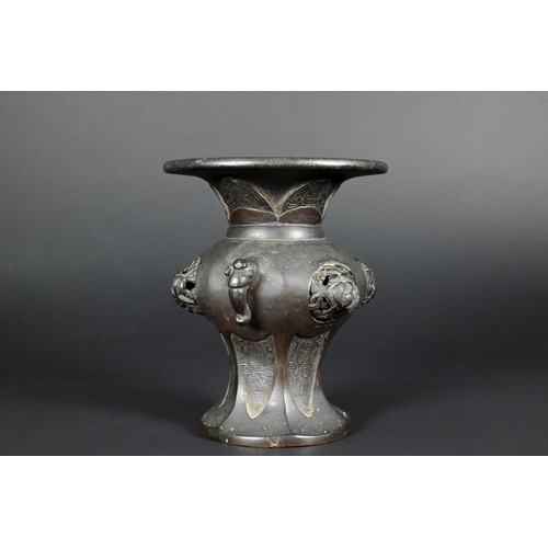 379 - A 19th century Chinese bronze archaistic vase with elephant mask handles and high relief floral roun... 