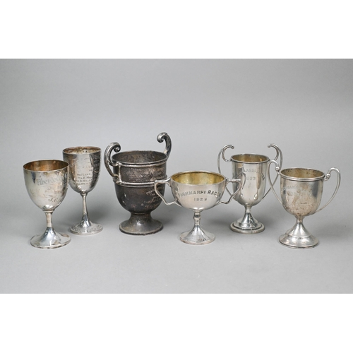 38 - Two silver trophy cups, 10.2oz, to/w three Indian Colonial cups stamped 'Orr Silver 23' and another ... 