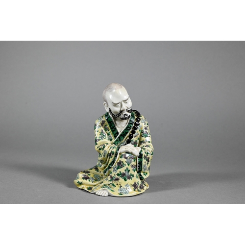 380 - A 19th/20th century Chinese famille jaune figure of the Daoist immortal Li Tieguai in the Kangxi sty... 