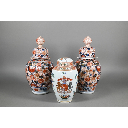 383 - A pair of 19th century Japanese Imari lidded lobed ovoid jars, Meji period, 29 cm high to/w a Samson... 