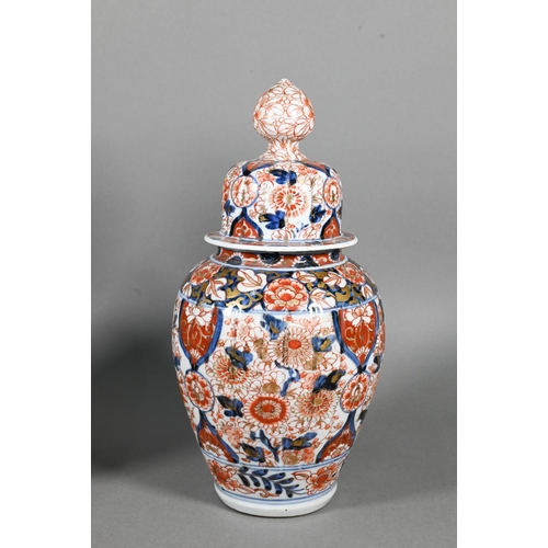 383 - A pair of 19th century Japanese Imari lidded lobed ovoid jars, Meji period, 29 cm high to/w a Samson... 