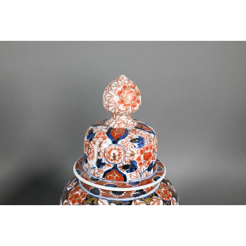 383 - A pair of 19th century Japanese Imari lidded lobed ovoid jars, Meji period, 29 cm high to/w a Samson... 