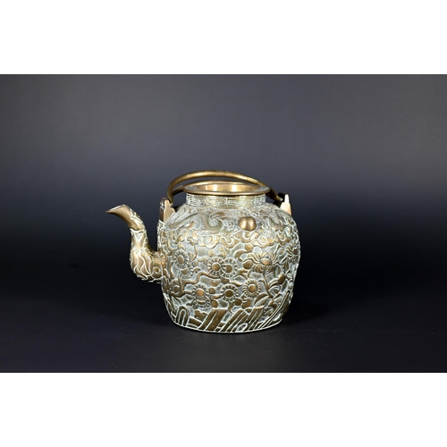 385 - A Chinese bronze twin-handled kettle or teapot with cover profusely chased and engraved with dragons... 