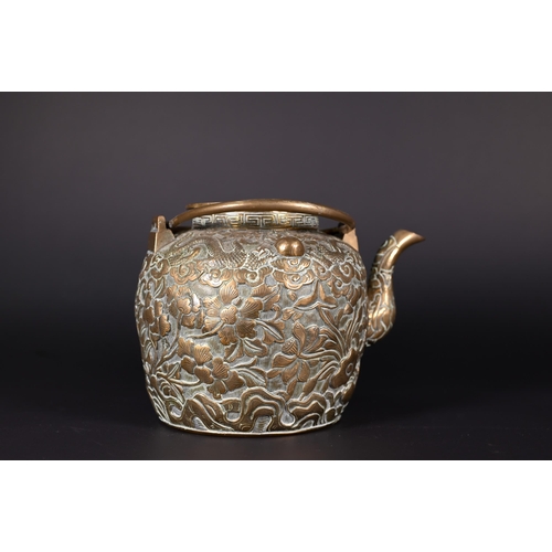 385 - A Chinese bronze twin-handled kettle or teapot with cover profusely chased and engraved with dragons... 