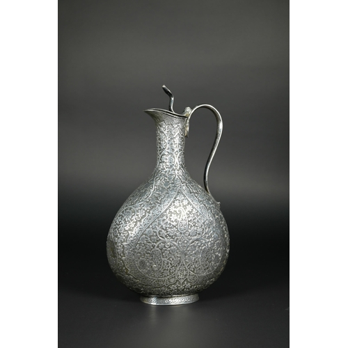 388 - A late 19th century Indian low grade silver moon flask ewer or claret jug, unmarked, finely chased a... 