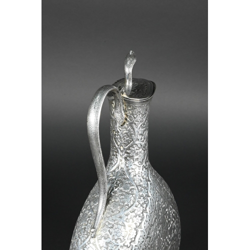 388 - A late 19th century Indian low grade silver moon flask ewer or claret jug, unmarked, finely chased a... 