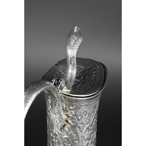 388 - A late 19th century Indian low grade silver moon flask ewer or claret jug, unmarked, finely chased a... 