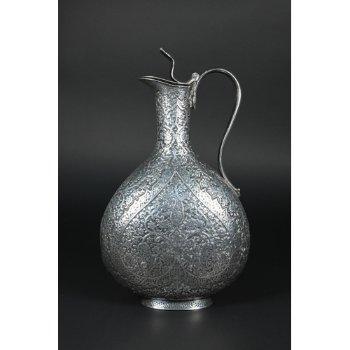 388 - A late 19th century Indian low grade silver moon flask ewer or claret jug, unmarked, finely chased a... 