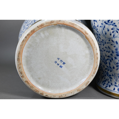 395 - A pair of 20th century Chinese blue and white temple jars and domed covers with karashishi lion fini... 