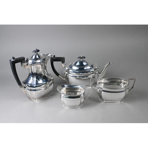 40 - A heavy quality silver four-piece tea service including hot water jug, with ebonised finials and com... 